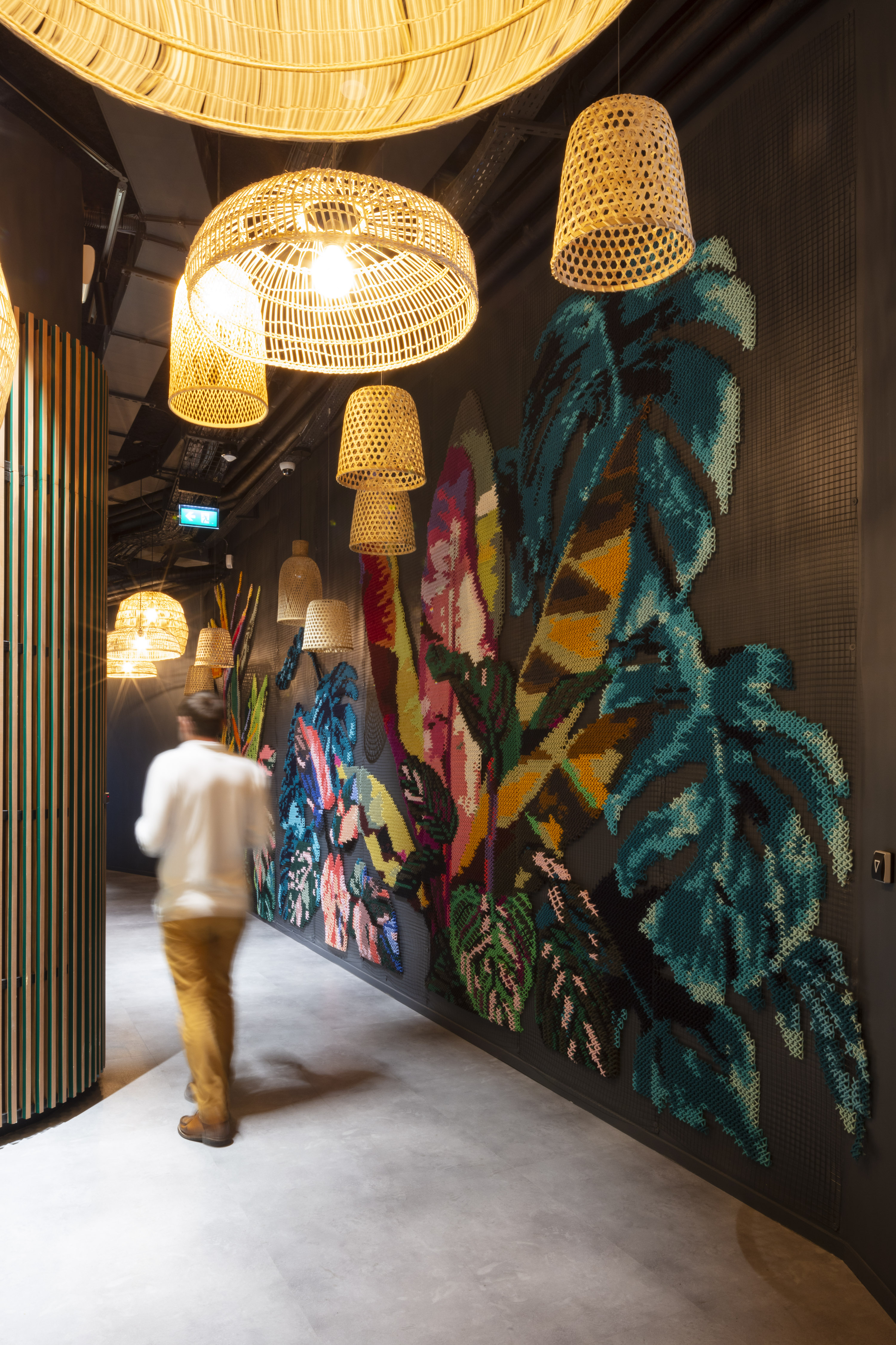 Davidson Consulting Paris — tropical embroidered mural on black metallic mesh