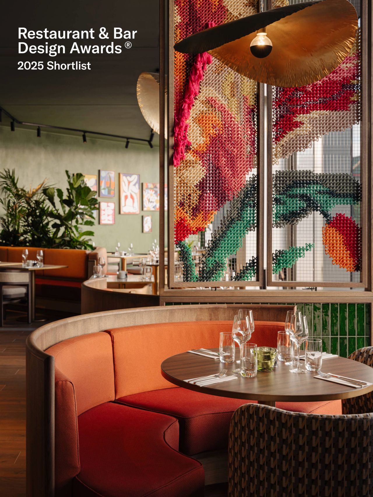 We Are EDN — close view of embroidered tulip panel with booth seating