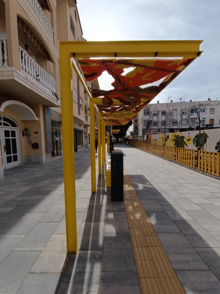 Katarsis — shade structure perspective along the street